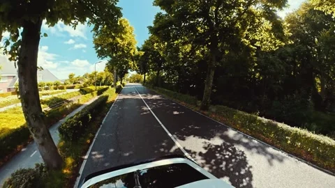Wide angle action camera perspective car driving on asphalt suburban road Stock Footage 341400320