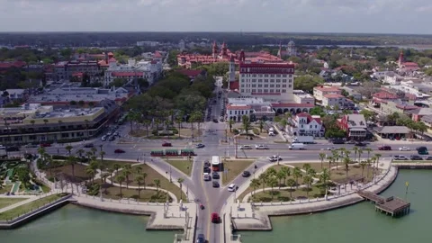 Wide-angle aerial capture of the St. Augustine Lighthouse standing tall over Stock Footage 332818493