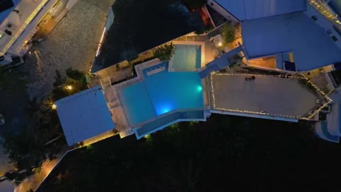 Wide angle aerial capturing Sundowers Villas with pool view focused scenery and Vidéo 328069189
