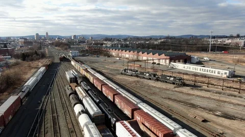 Wide angle aerial pullback drone shot reveals Reading Railroad yard, Vídeo Stock 124639358