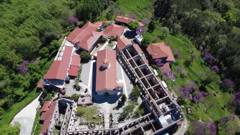 Wide angle aerial shot above Orthodox monastery and stone fortress walls Stock Footage 337046991