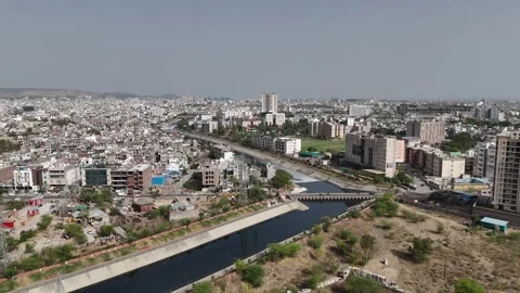 Wide-angle aerial shot capturing residential buildings and city life in Jaipur Stock Footage 308725045