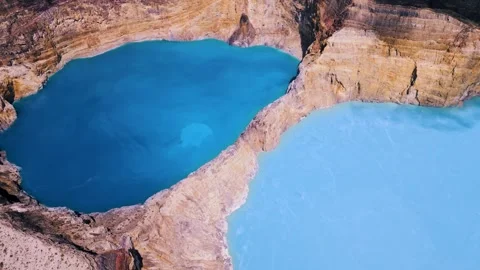 Wide Angle Aerial Shot of Giant Deep Blue and Cyan Kelimutu Crater Lakes Stockbeeldmateriaal 337916082