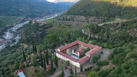 Wide angle aerial view of Byzantine monastery castle with wall and tower Stock Footage 343960943