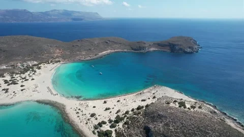 Wide angle aerial view of calm Greek cove with sailboats and beach Stock Footage 337047646