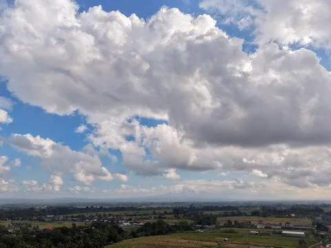 Wide angle aerial view of dramatic fluffy white clouds rural landscapes Bali Фото