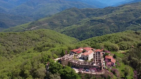 Wide angle aerial view of historic mountain monastery and green ranges Stock Footage 337047012