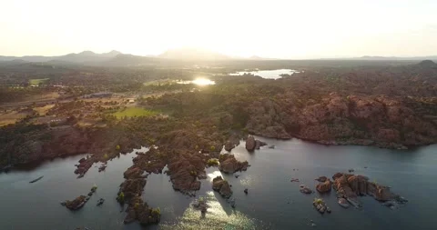 Wide angle aerial view of lake at sunset in Prescott Arizona Stock Footage