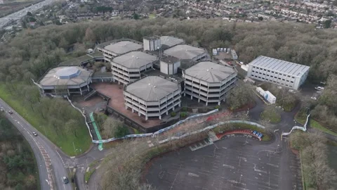 A wide-angle aerial view of old brutalist offices under redevelopment Video stock 297349680