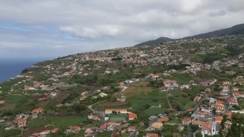 Wide-angle aerial view of Ponta do Sol’s inland region, focusing on Canhas’ Stock Footage 345643023