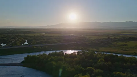 Wide-Angle Aerial View of Sunset over Zhaosu Wetland Park and Tekes River Видео 342391127