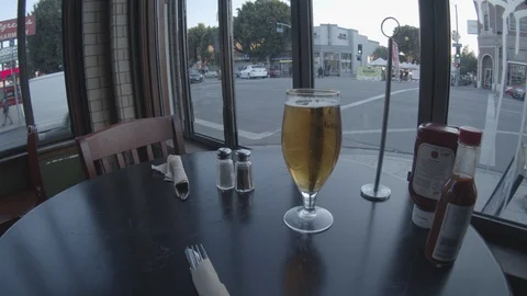 Wide Angle of Beer, patiently waiting on food at restaurant Stock Footage 101437775