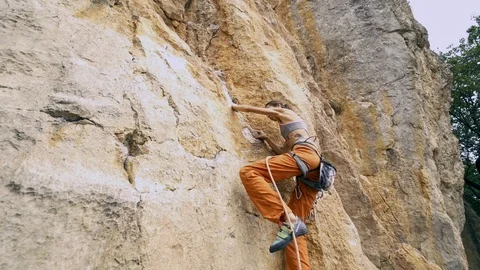 Wide angle bottom view Young fit woman rock climbing on sport route outdoors Stock Footage 119302282