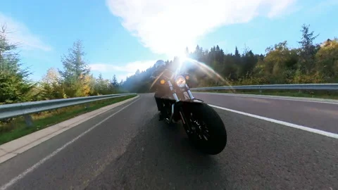 Wide-angle camera footage of professional black speed biker riding motorcycle Stock Footage 167921330