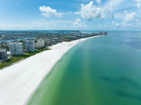 Wide angle capture from a drone of the beach and multiple hotels and condos.. Stock Photos