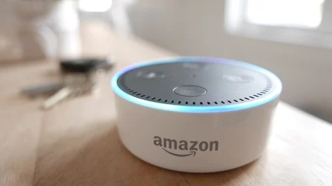 Wide angle closeup of Amazon Echo Dot activating after command.  Editorial clip. Stock Footage 103321294