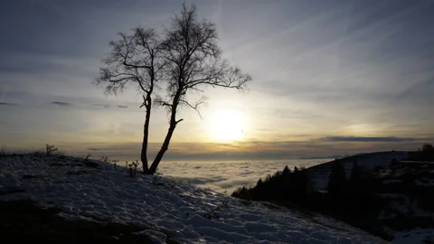 Wide-angle cloud sea time-lapse at sunset from a mountain top shot at 16mm Stock Footage 229772520
