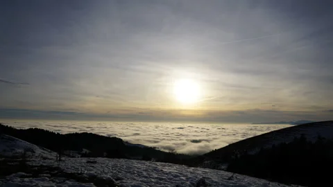 Wide-angle cloud sea time-lapse at sunset from a mountain top shot at 16mm [1] Stock Footage 229772534