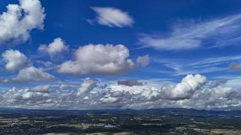 A wide-angle composition that highlights the contrast between a dynamic, clou Stock Photos