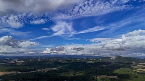 A wide-angle composition that highlights the contrast between a dynamic, clou Stock-Fotos