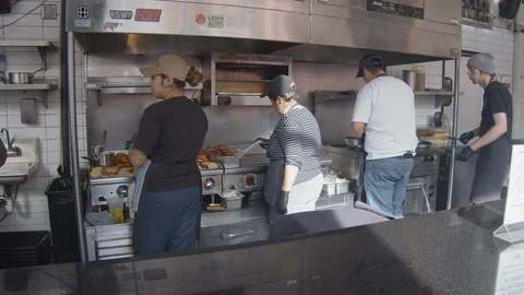 Wide Angle of Cooks Making Eggs at Market Dinner Stock Footage 101441164