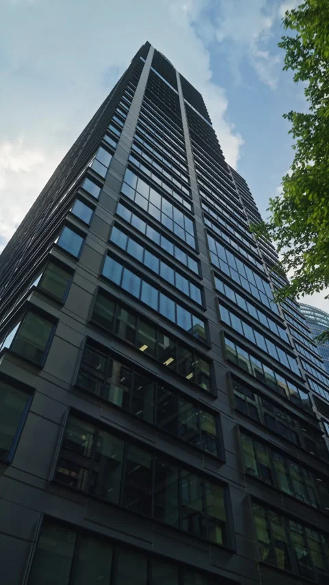 Wide angle dolly shot modern skyscraper office tower business building Stock Footage 335731633