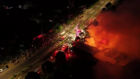 Wide-Angle Drone Orbit of Emergency Response to a Major Nighttime Fire 動画素材 337345685