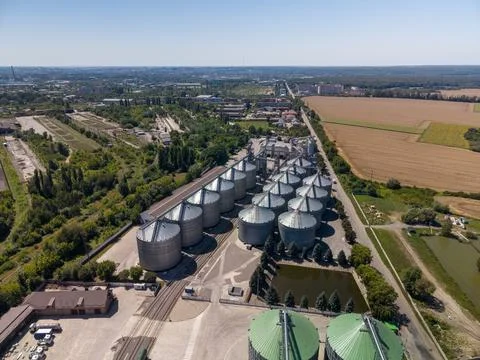 Wide Angle Drone View of Large Grain Elevator Storage Silos and Farmland Stock Photos