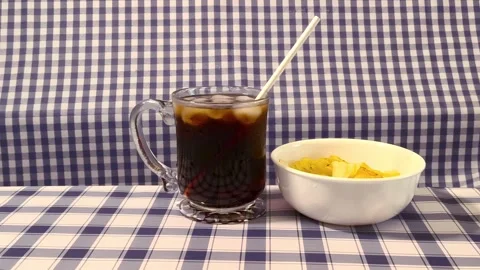 Wide angle front view cola served in a glass cup with ice, straw liquor, an.. Video stock 318127824