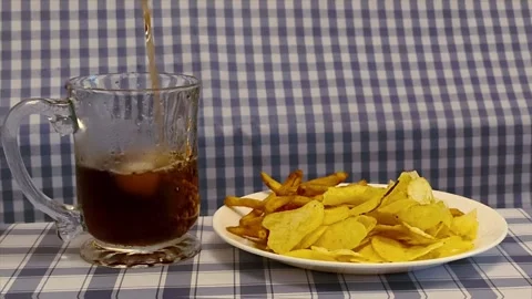 Wide angle front view of crispy golden French fries with fries and chips on.. Stockbeeldmateriaal 318127239