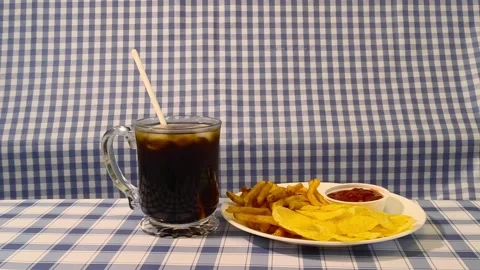 Wide angle front view of crispy fried french fries, chips, and ketchup on a.. Stock Footage 318127885