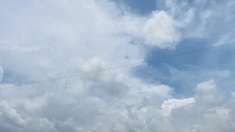 Wide Angle Full Frame Shot of Fluffy White Clouds and Blue Sky Stock Photos