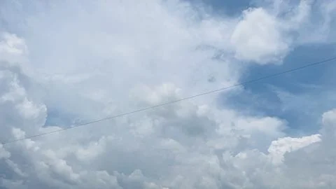 Wide Angle Full Frame Shot of Fluffy White Clouds and Blue Sky Stock Photos