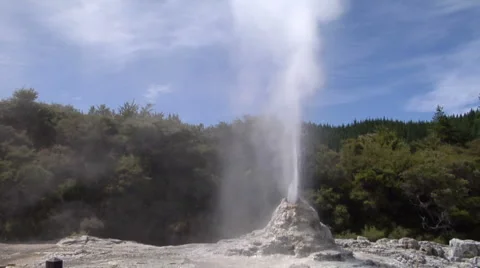 Wide angle geyser erupting, wind blowing Stock Footage 2525153