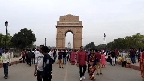 Wide angle gimbal clip walking towards india gate in new delhi Stock Footage 106918969