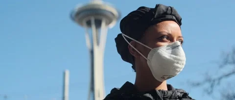 Wide angle Girl in mask dramatic look to camera Stock Footage 130669402