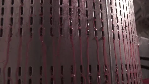 Wide angle, grape juice extracted by mechanical stainless steel wine press. Stock Footage 153813317
