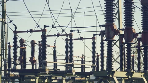 Wide angle, high voltage substation with tall pylons  Stock Footage 142591425