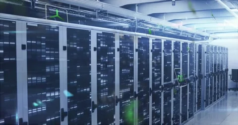On wide-angle hold, green digital icons drifting over server cabinets showing 库存影片 328718734