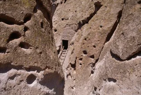 Wide-angle image of cliff dwelling and ladder. highly textured canyon walls and  Stock Photos