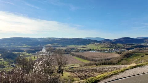 With a wide angle includes farmland, roads, houses, vineyards and mountains. 動画素材 314907333