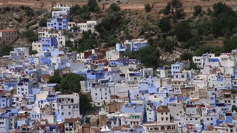 Wide angle landscape shot of blue town Chefchaouen Chaouen / Morocco Stock Footage 77970711