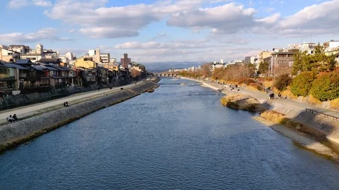 Wide-angle landscape view of Kamo River seen from the Shijo Bridge in Kyoto City Stock Footage
