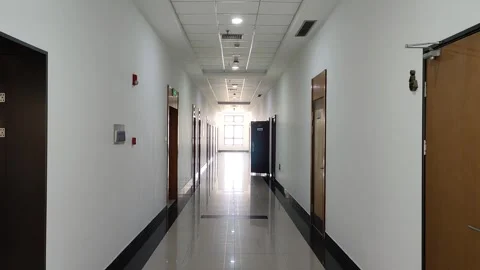 Wide angle of a long empty corridor hallway . Stock Footage 263443130