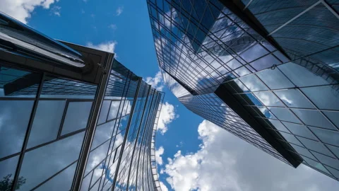 Wide angle looking up time-lapse financial district glass skyscrapers blue sky Stock Footage 337647593