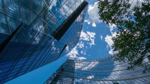 Wide angle looking up time-lapse financial district glass skyscrapers blue sky Stock-Footage 337647595