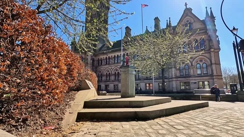 Wide-angle low-angle cinematic view of Bradford City Hall and monument steps Stock Footage 334995604