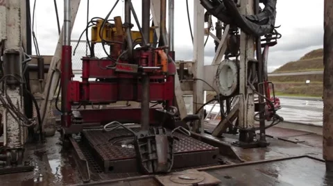 Wide Angle to Low Angle Shot of an oil and gas drill Stock Footage 45236389