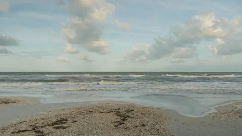 Wide angle Low view of Pass-s-grille beach in St. Pete Beach Florida looking wes Stock Footage 281963421