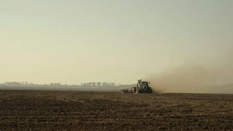 Wide Angle of Modern Tractor Towing Precision Air Seeder Sowing Crops Stock Footage 305260539